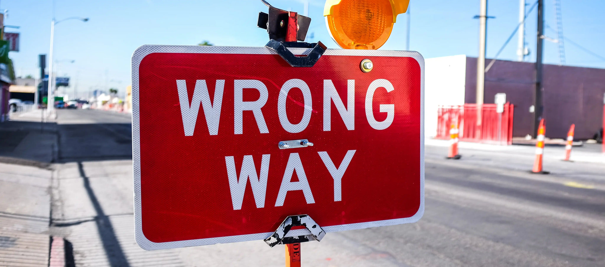 A traffic sign showing "wrong way", as a link to burnout and overwork that cause difficult situations for people